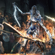 An image of two Dark Souls 3 players battling against a screen-sized boss.